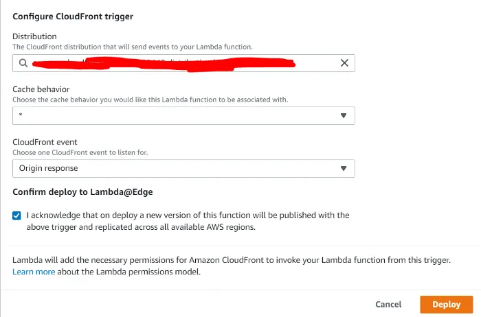 The Configure CloudFront trigger dialog. The cache behavior is the wildcard, the CloudFront event is Origin response, and the acknowledgement that deploying publishes a new version replicated across all AWS regions is ticked